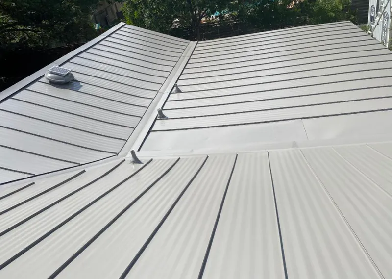 Solar attic fan installed on a metal roof for Roof Ventilation in Wichita Falls
